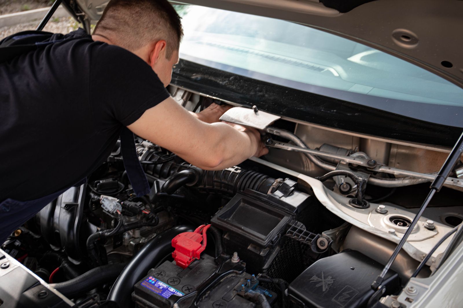 Technician under the hood